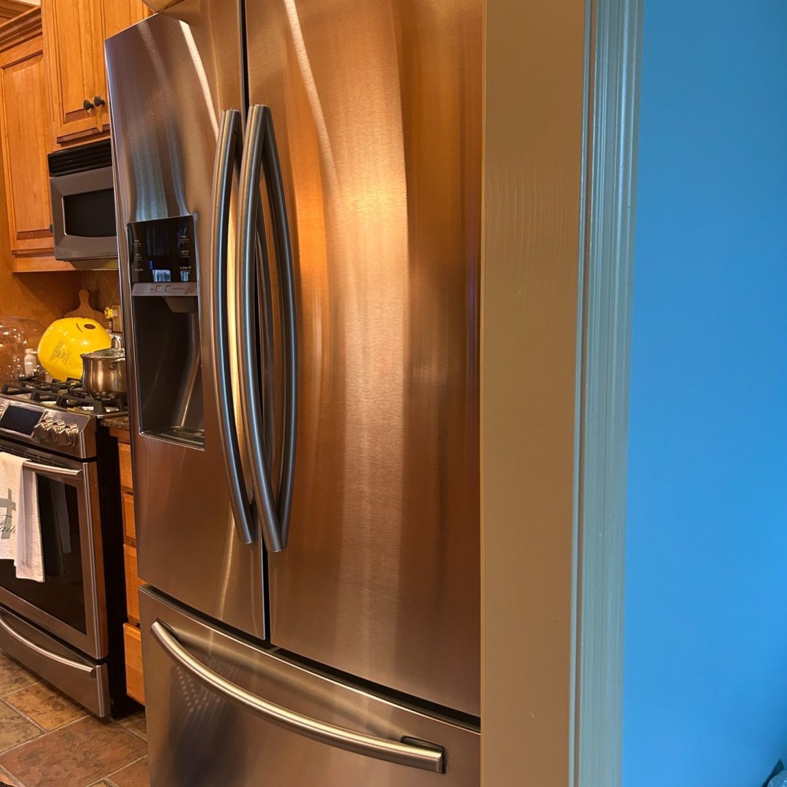 Stainless steel refrigerator in kitchen